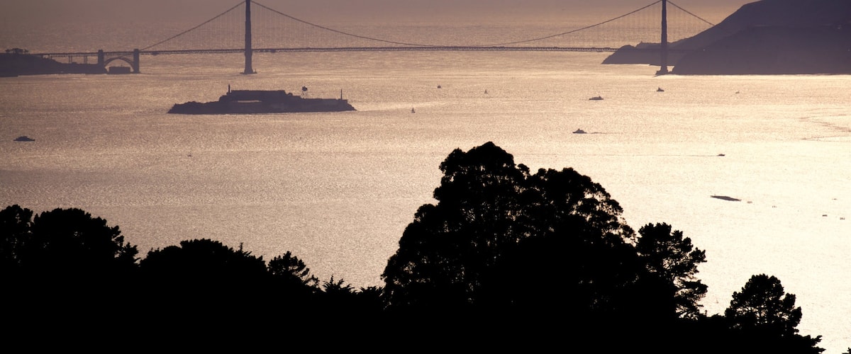 Berkeley which includes a sunset, general coastal views and a river or creek