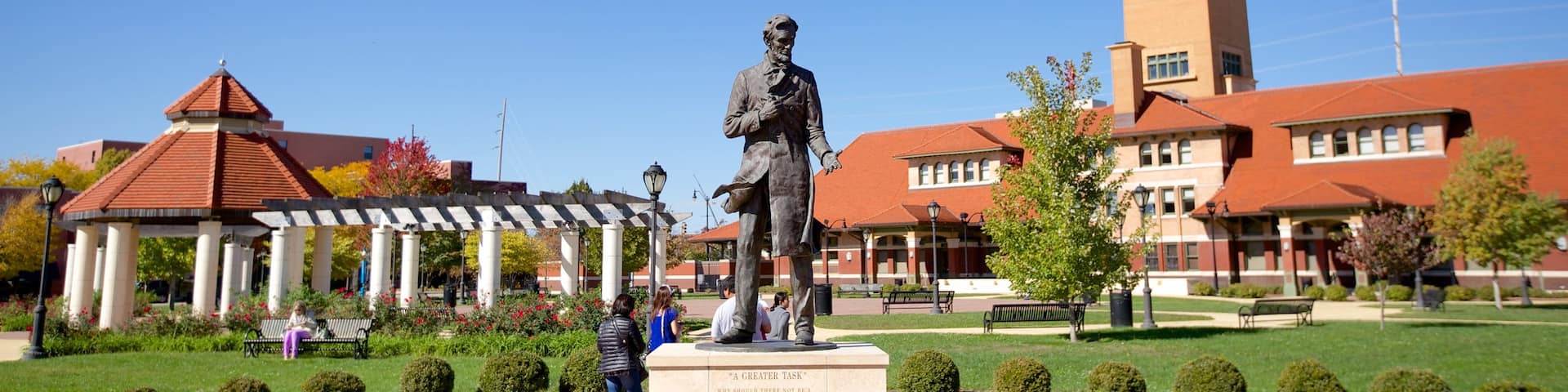 Union Station which includes a garden and a statue or sculpture