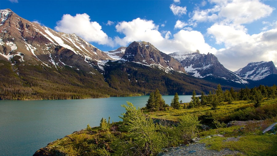 St. Mary Lake which includes landscape views, a river or creek and mountains