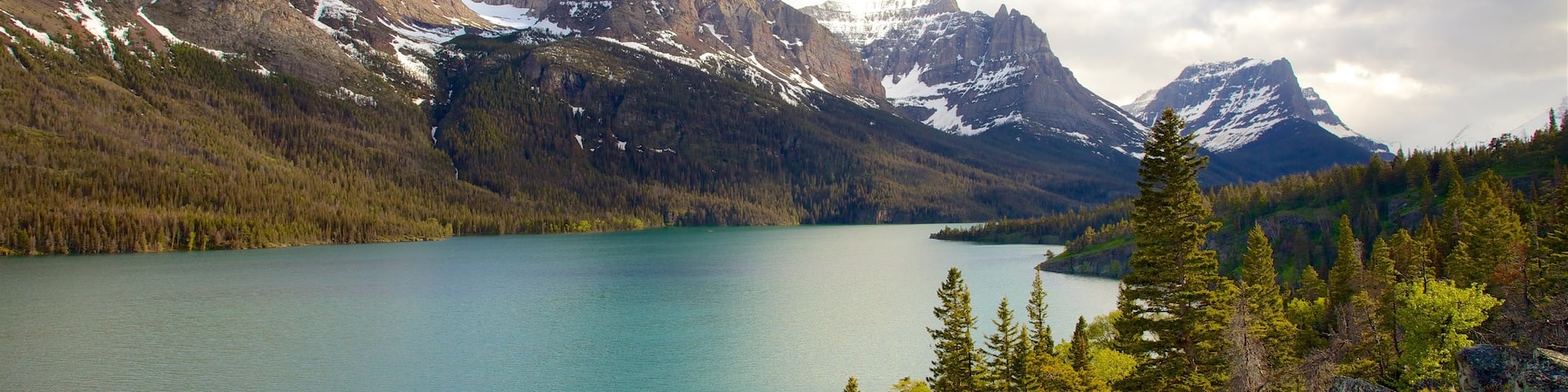 St. Mary Lake featuring landscape views, a river or creek and tranquil scenes