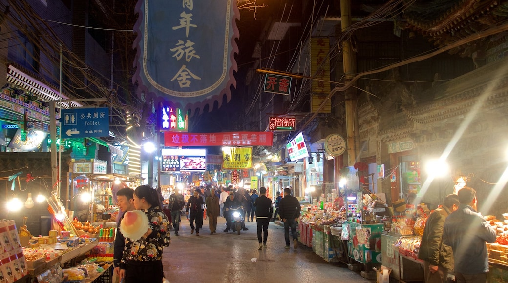 Xi\'an showing markets and night scenes as well as a small group of people