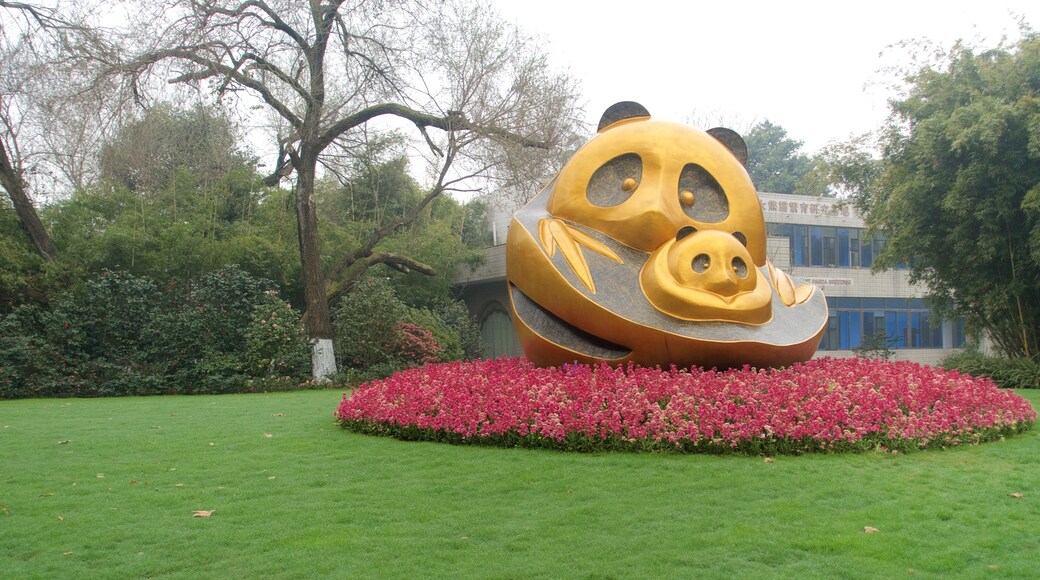 Giant Panda Breeding Research Base showing a garden, flowers and outdoor art