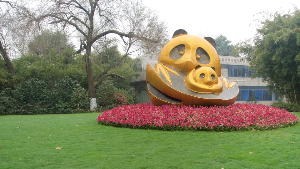 Giant Panda Breeding Research Base featuring outdoor art, flowers and a garden