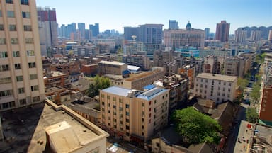 Kunming mostrando uma cidade, um edifício e paisagem