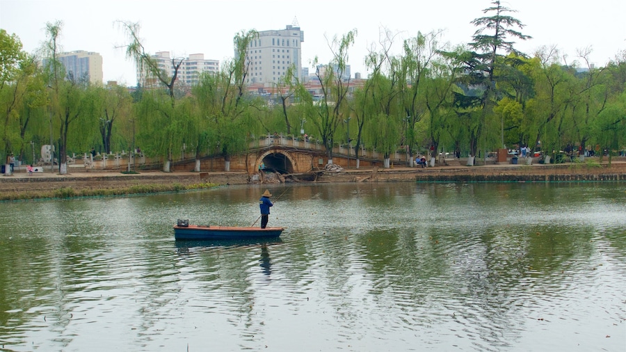 Green Lake Park featuring a river or creek, a city and boating
