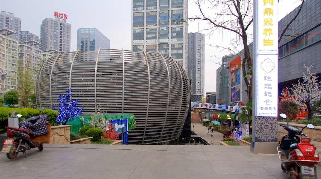 Kunming showing a city, a high rise building and signage