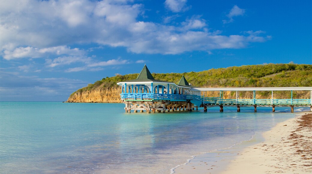 Dickenson Bay Beach showing general coastal views, a sandy beach and rugged coastline