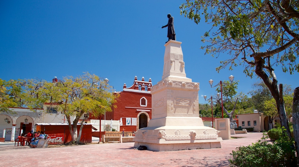 Lerma mostrando un jardín y una estatua o escultura