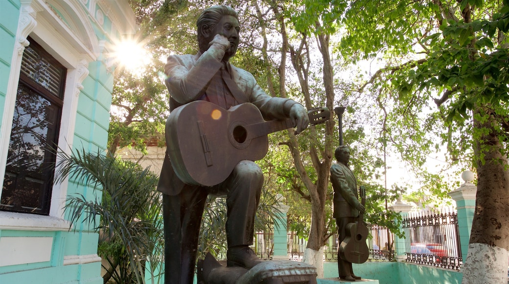 Museum of the Yucatecan Song featuring a statue or sculpture and a garden