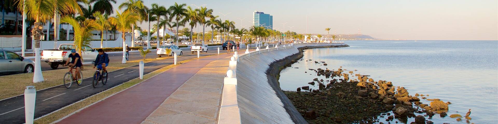 Campeche Waterfront Promenade featuring a sunset, road cycling and general coastal views