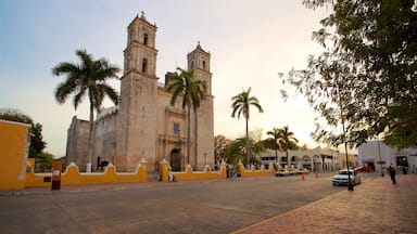 Cathedral of San Gervasio featuring heritage architecture and a sunset