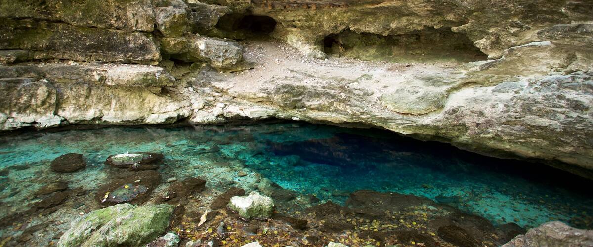 Cenote X\'batun which includes a lake or waterhole