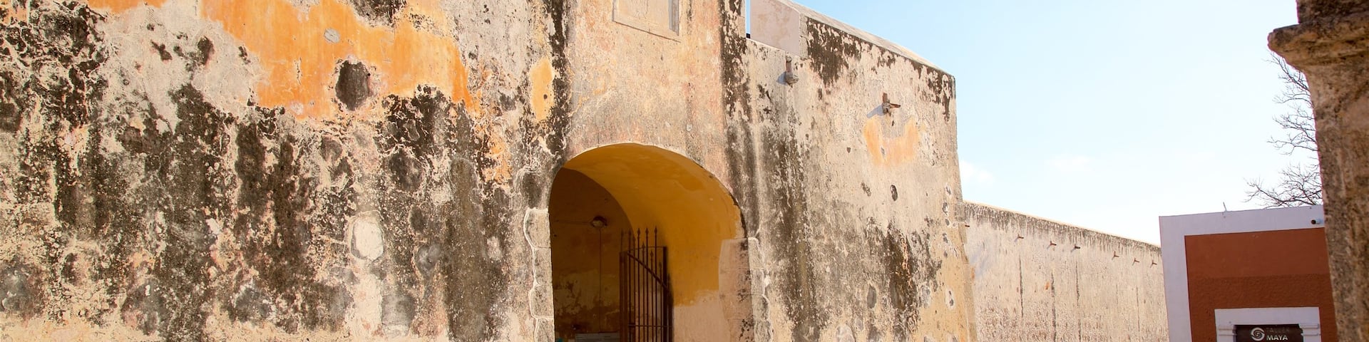 Puerta de Tierra showing heritage elements as well as an individual male