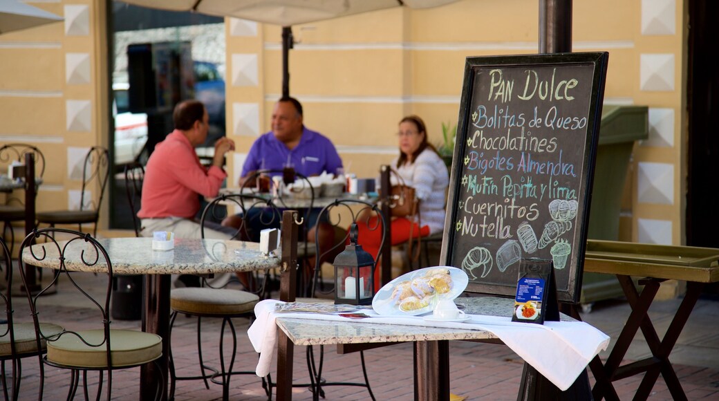 Hidalgo Park which includes signage and outdoor eating as well as a small group of people