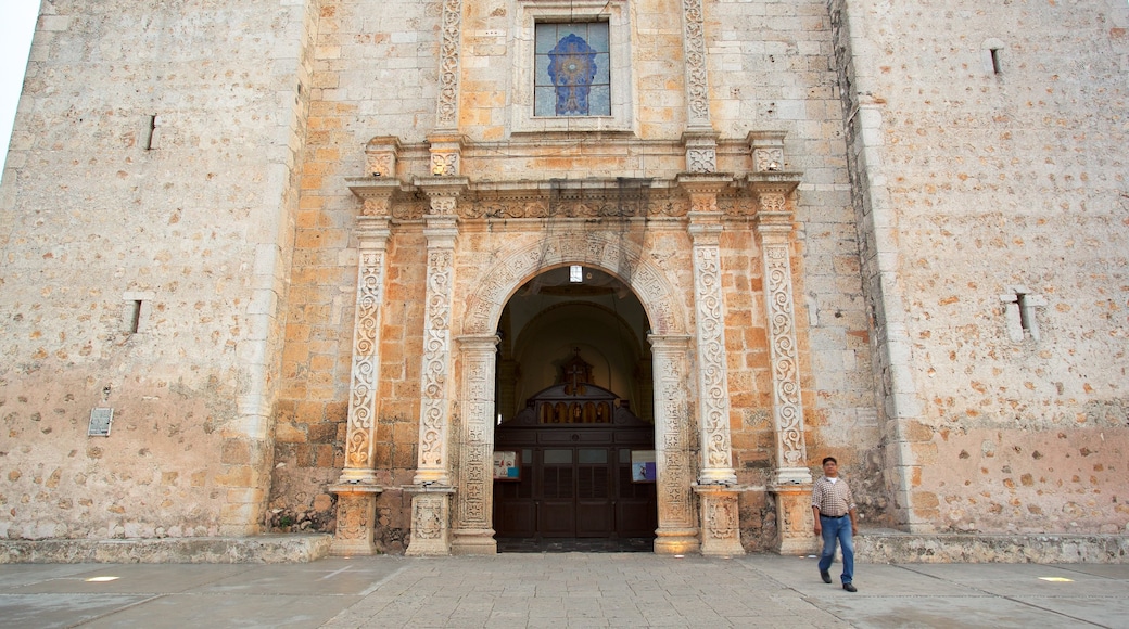 Cathedral of San Gervasio showing heritage elements as well as an individual male