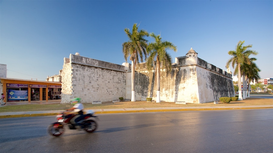 Campeche showing motorcycle riding, a sunset and heritage architecture