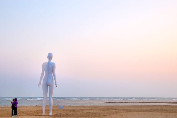 Dadaepo Beach showing a sandy beach, a sunset and general coastal views