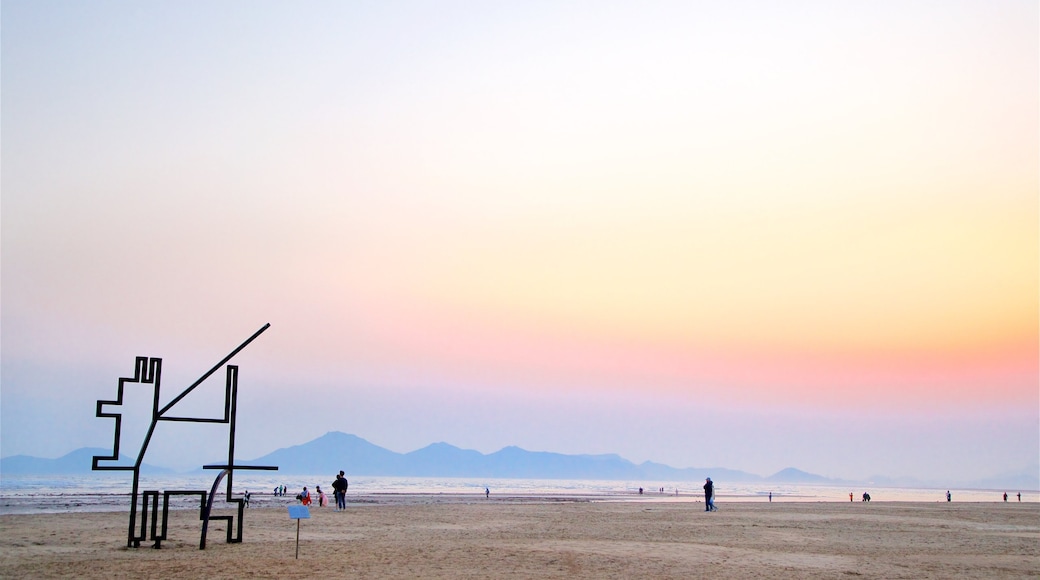 Dadaepo Beach showing a beach, general coastal views and a sunset