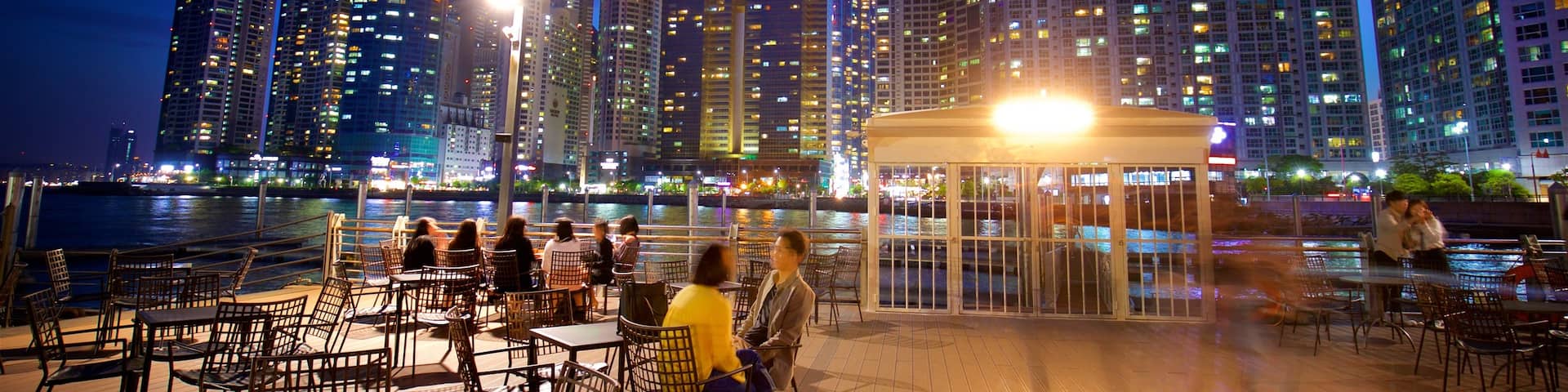 Busan showing a skyscraper, a city and outdoor eating