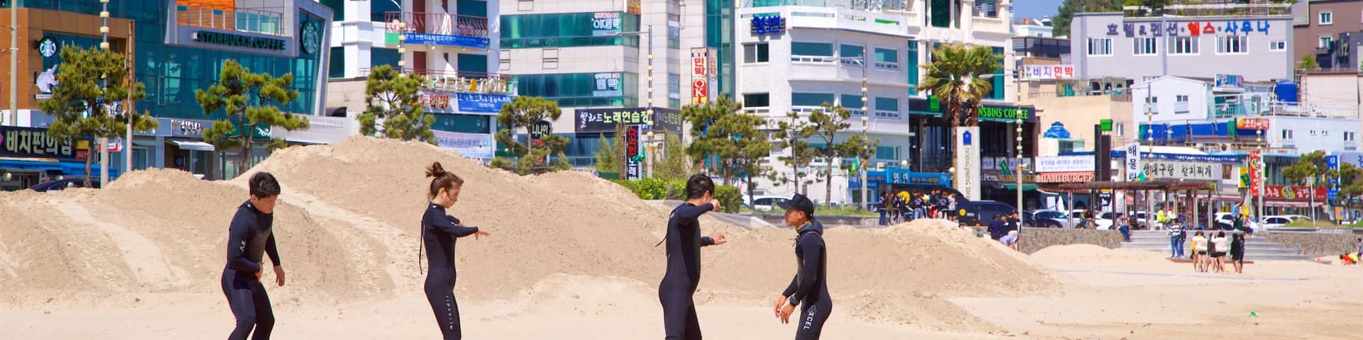 Songjeong Beach showing general coastal views, a coastal town and a beach