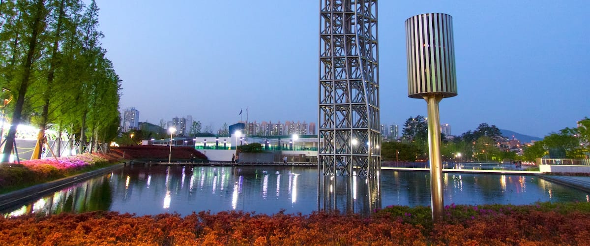 Busanjin which includes wildflowers and a lake or waterhole