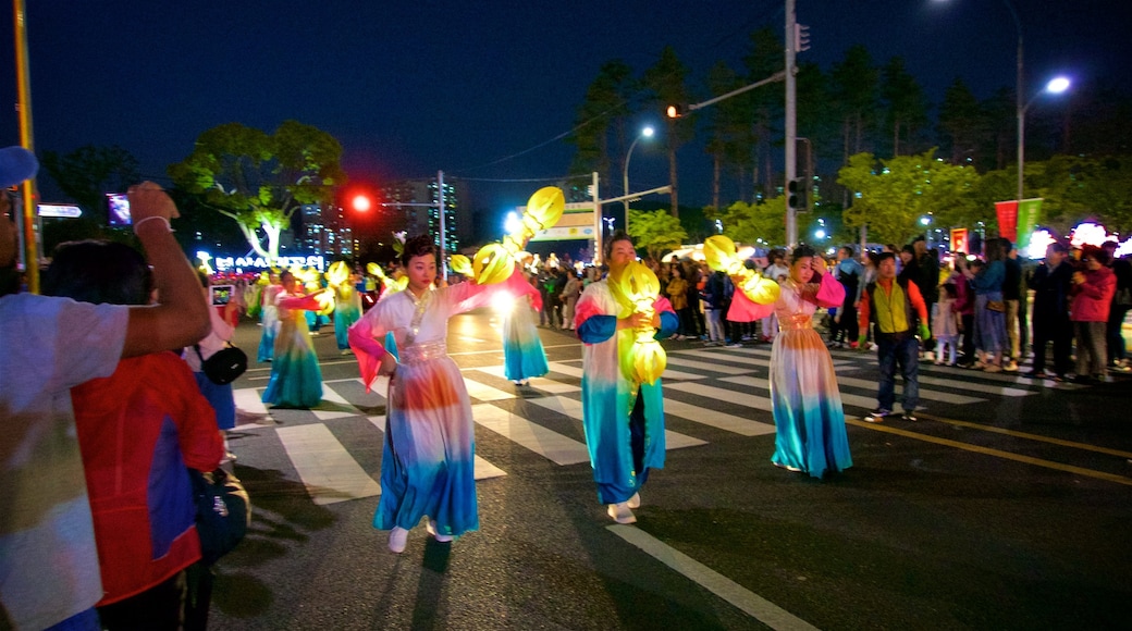 Busanjin showing street performance and night scenes as well as a small group of people