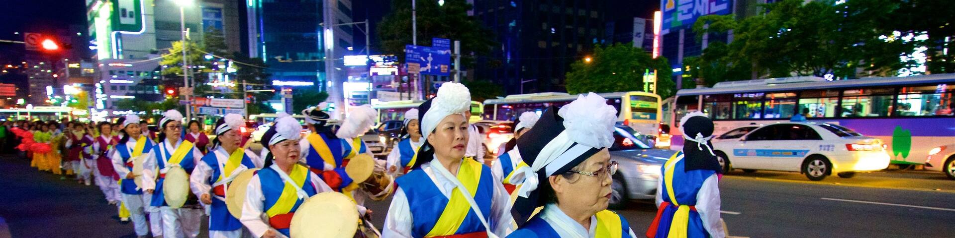 Busanjin showing night scenes and street performance as well as a small group of people