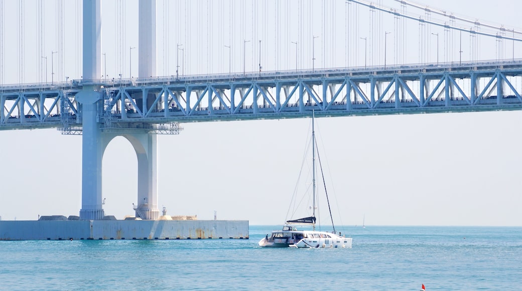 Gwangalli Beach which includes a bridge, general coastal views and boating