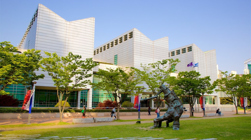 Busan Museum of Art featuring a park, outdoor art and a city