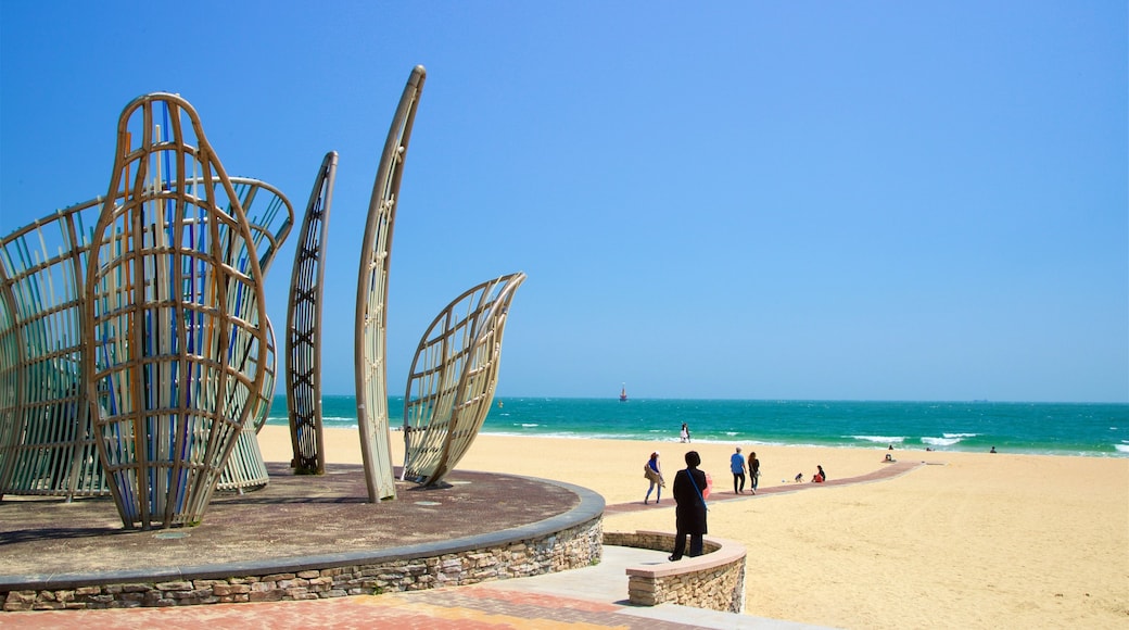 Haeundae Beach which includes a beach, general coastal views and outdoor art