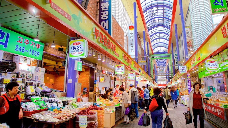 Gukje Market featuring interior views and markets as well as a small group of people