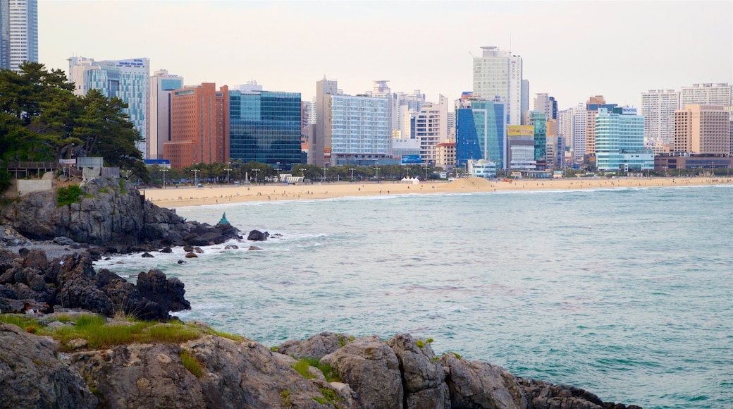 Dongbaekseom Park which includes general coastal views, a city and a beach