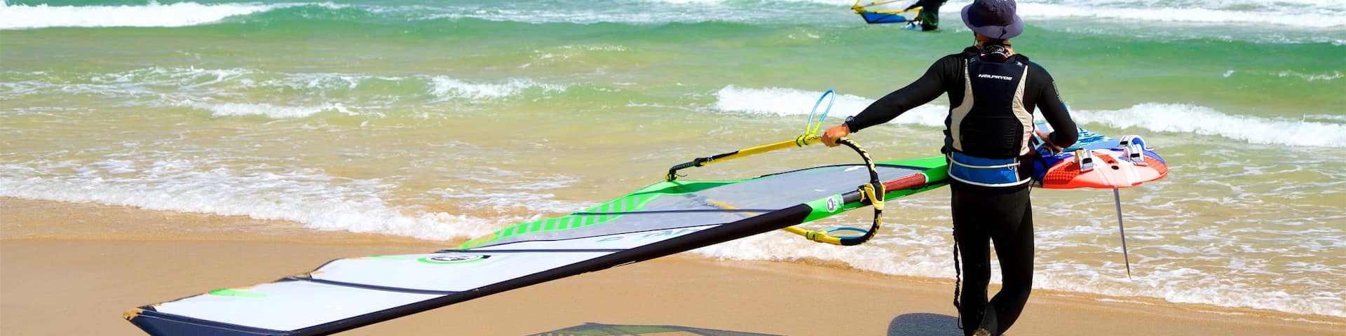 Songjeong Beach showing waves, general coastal views and kite surfing