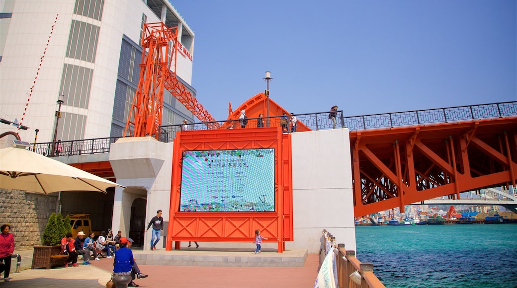 Yeongdodaegyo Bridge which includes a bridge and a river or creek as well as a small group of people