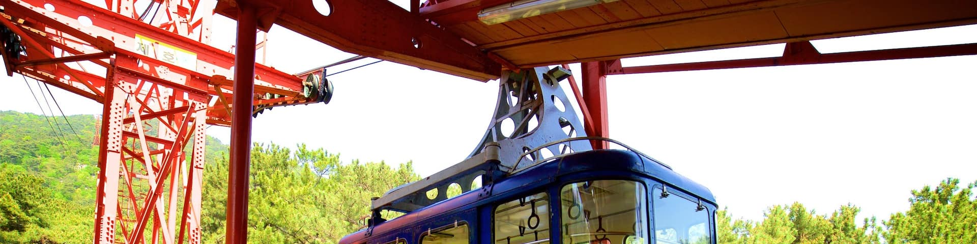 Namsan Cable Car featuring a gondola as well as a small group of people