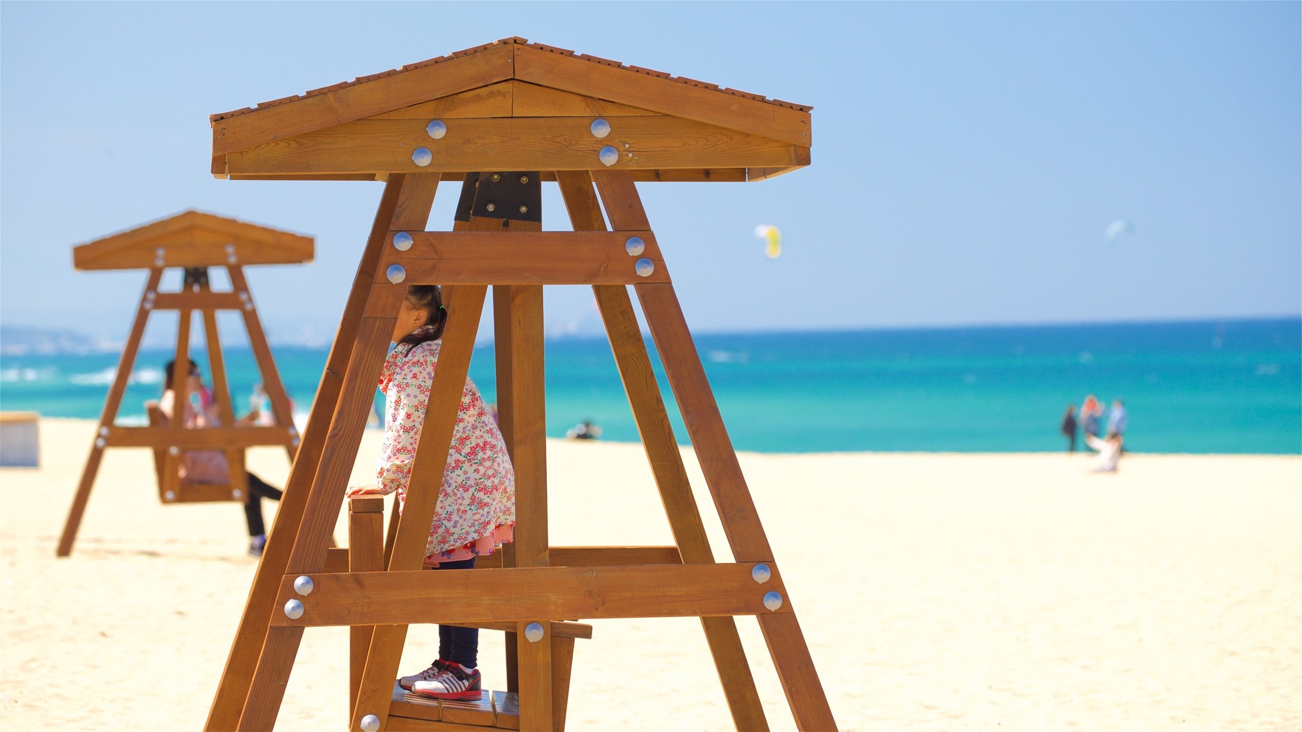Anmok Beach which includes general coastal views and a sandy beach as well as an individual child