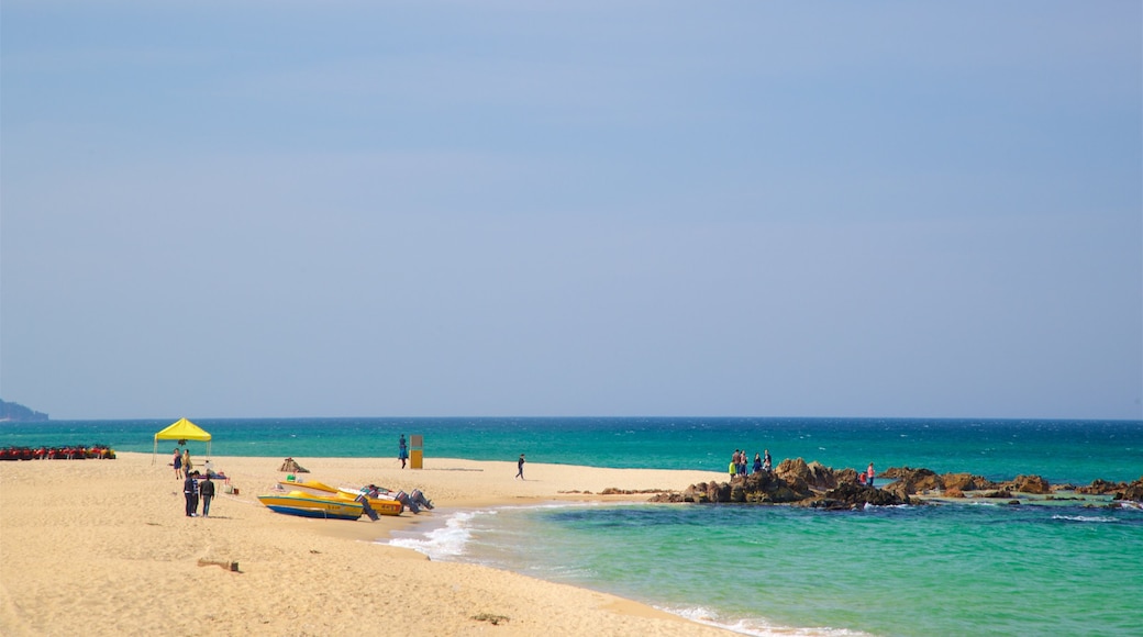 Jeongdongjin Beach showing general coastal views, a sandy beach and rugged coastline