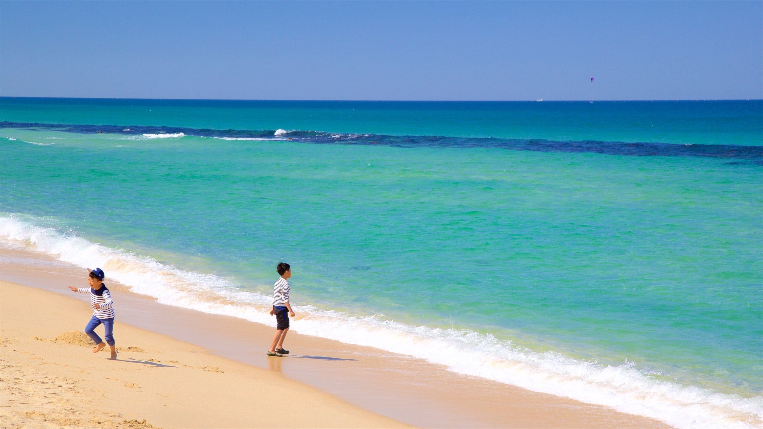 Anmok Beach featuring a sandy beach and general coastal views as well as children