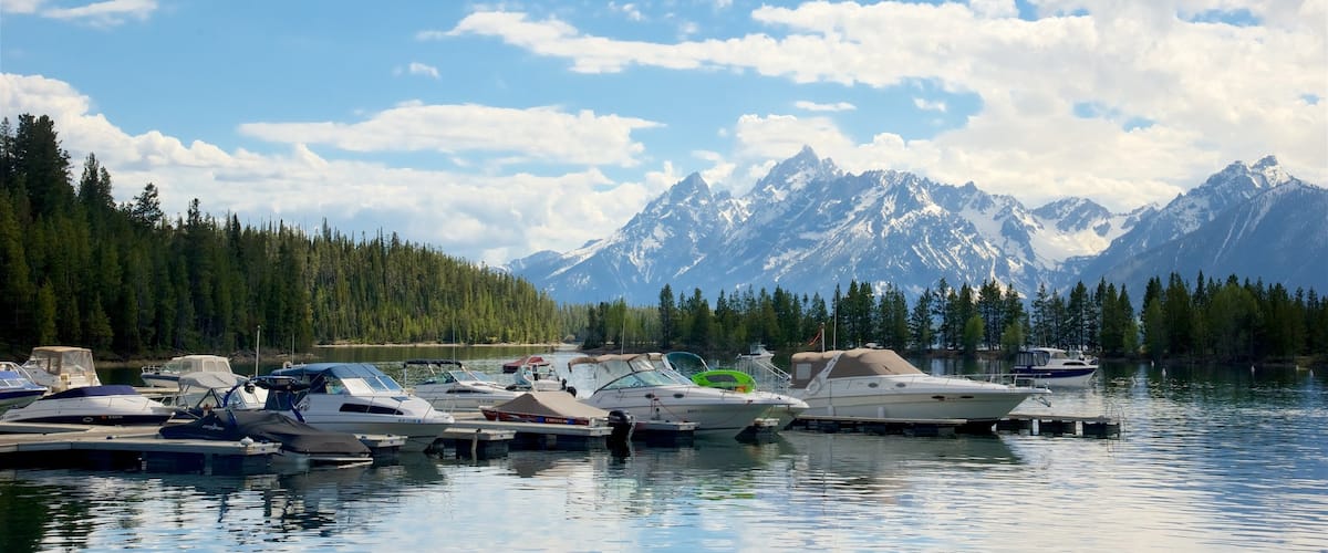 Colter Bay Visitor Center showing mountains and a river or creek