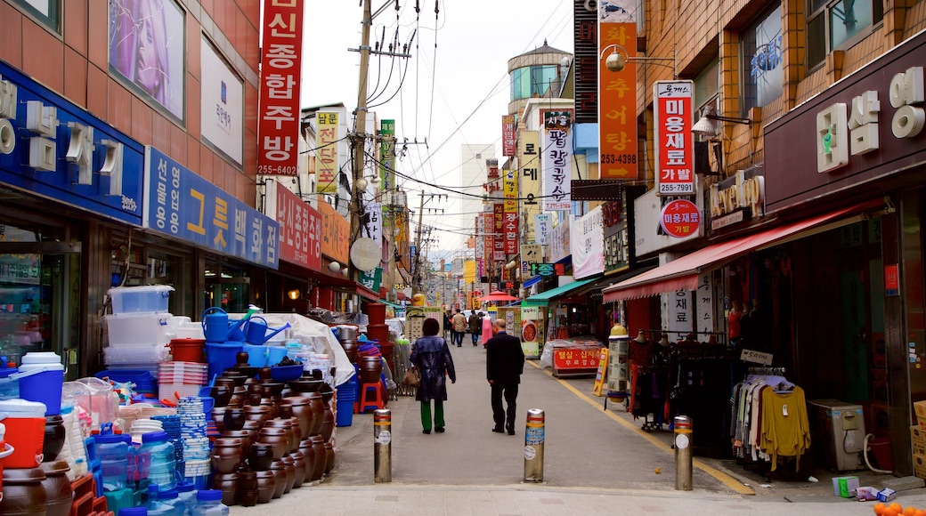 Suwon featuring signage as well as a couple