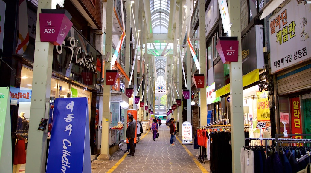 Suwon showing interior views and shopping as well as a small group of people