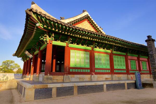 Hwaseong Haenggung Palace featuring a sunset and heritage architecture
