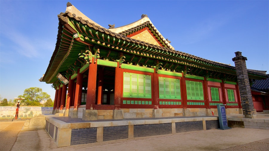 Hwaseong Haenggung Palace which includes heritage architecture and a sunset