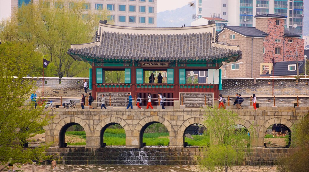 Hwahongmun Gate featuring a city, heritage architecture and a bridge