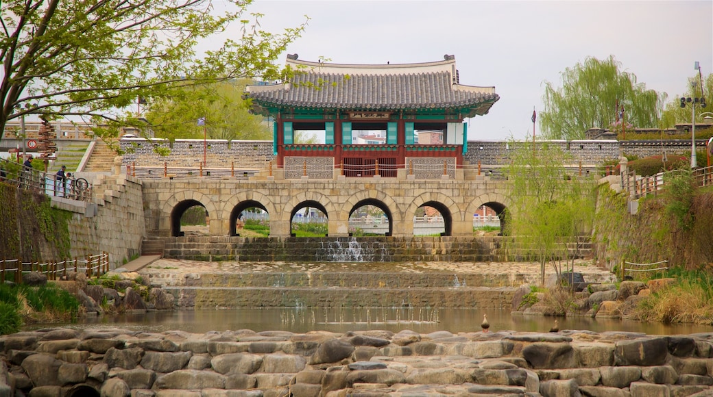 Hwahongmun Gate showing a river or creek, a bridge and heritage architecture