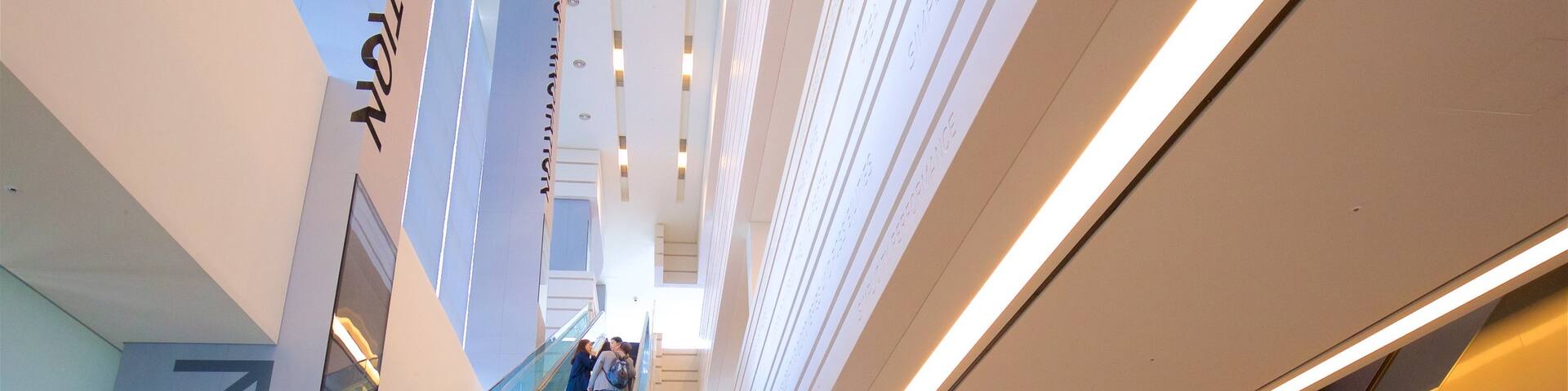 Samsung Innovation Museum showing interior views as well as a small group of people