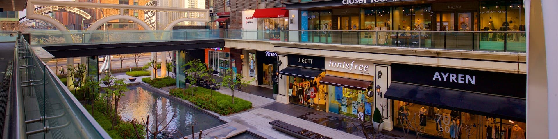 NC Cube Canal Walk which includes signage, city views and a bridge