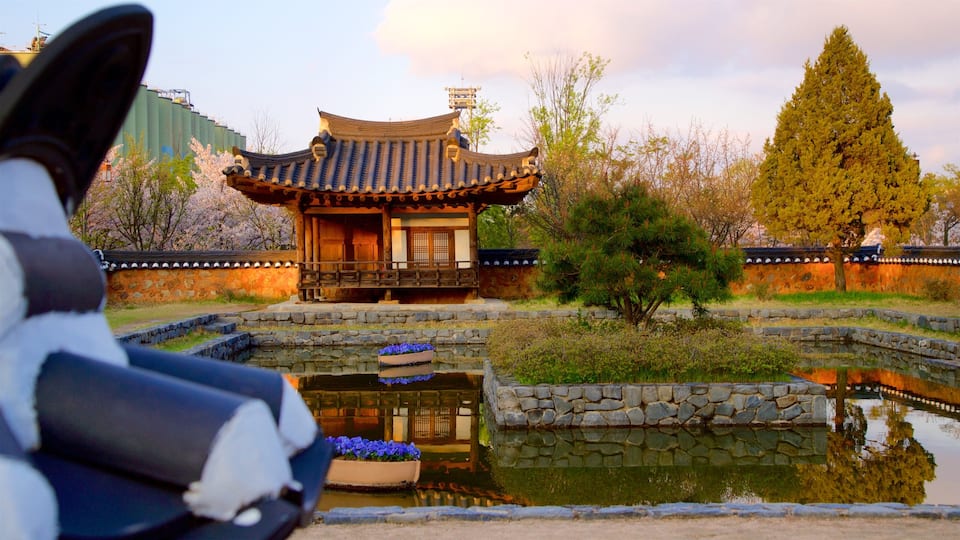 Wolmi Traditional Park which includes a park, a pond and a sunset