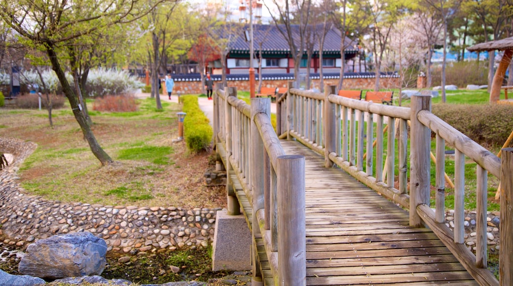 Wolmi Traditional Park showing a bridge and a park