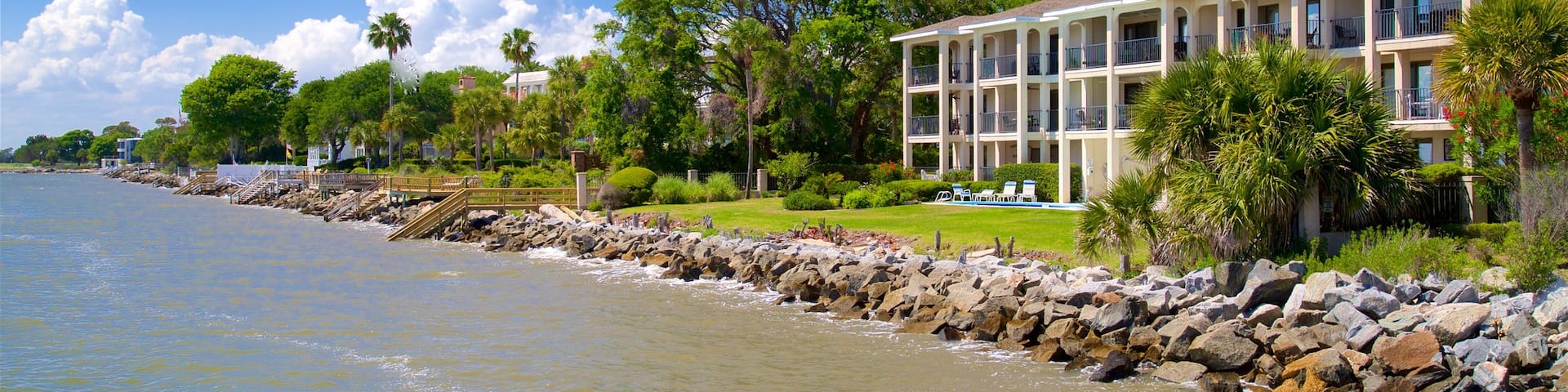 St. Simons Island Pier which includes a river or creek and a house